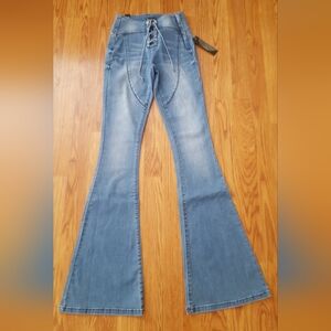 Bebe Lace Up Mid Rise Flare Jeans